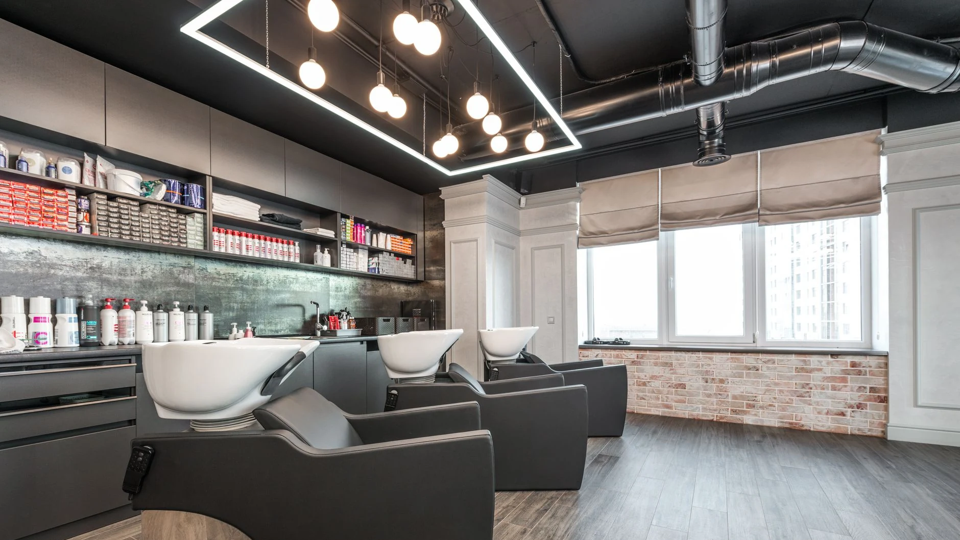 barber at work, wide interior shot at Fantasy Hair Salon
