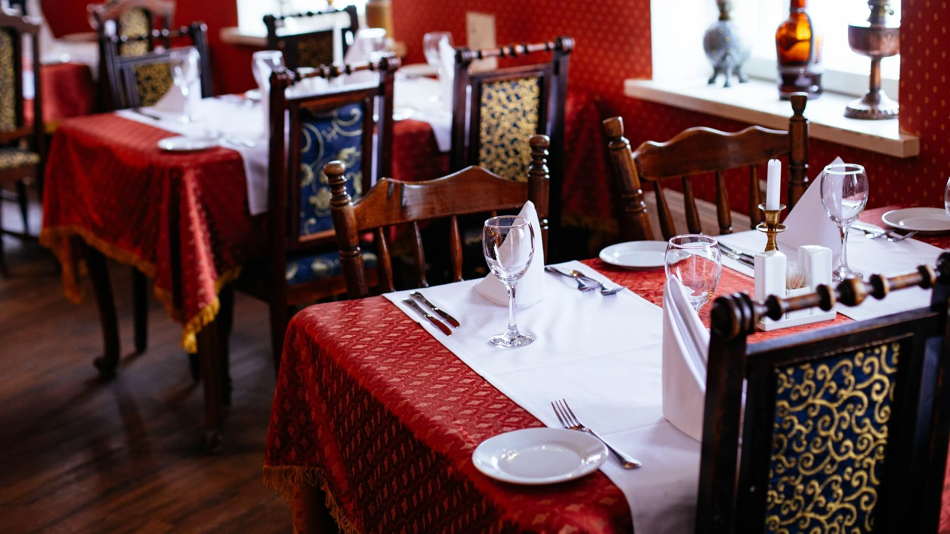 Set tables in restaurant dining room at Konoba Bracera
