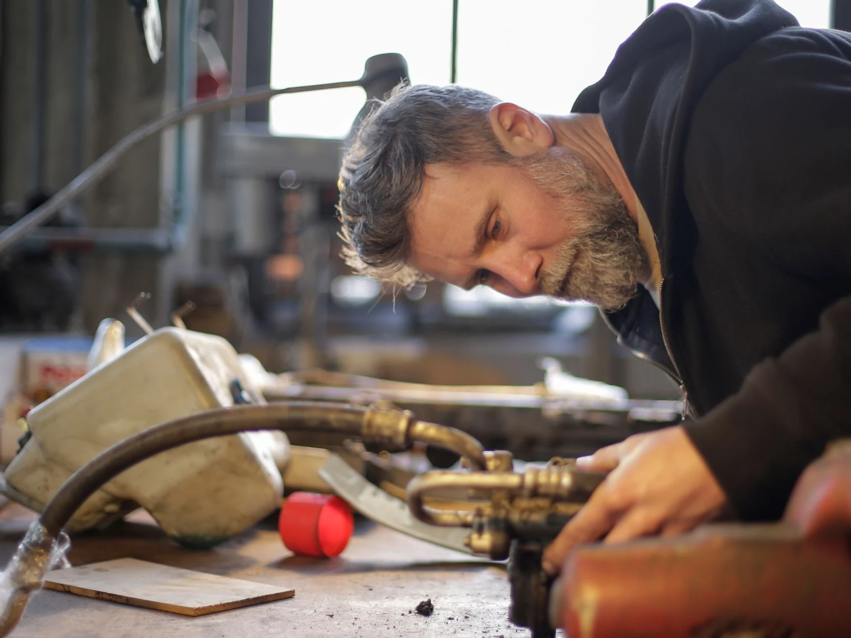 plumber working at Oakley Plumbing And Heating Solutions