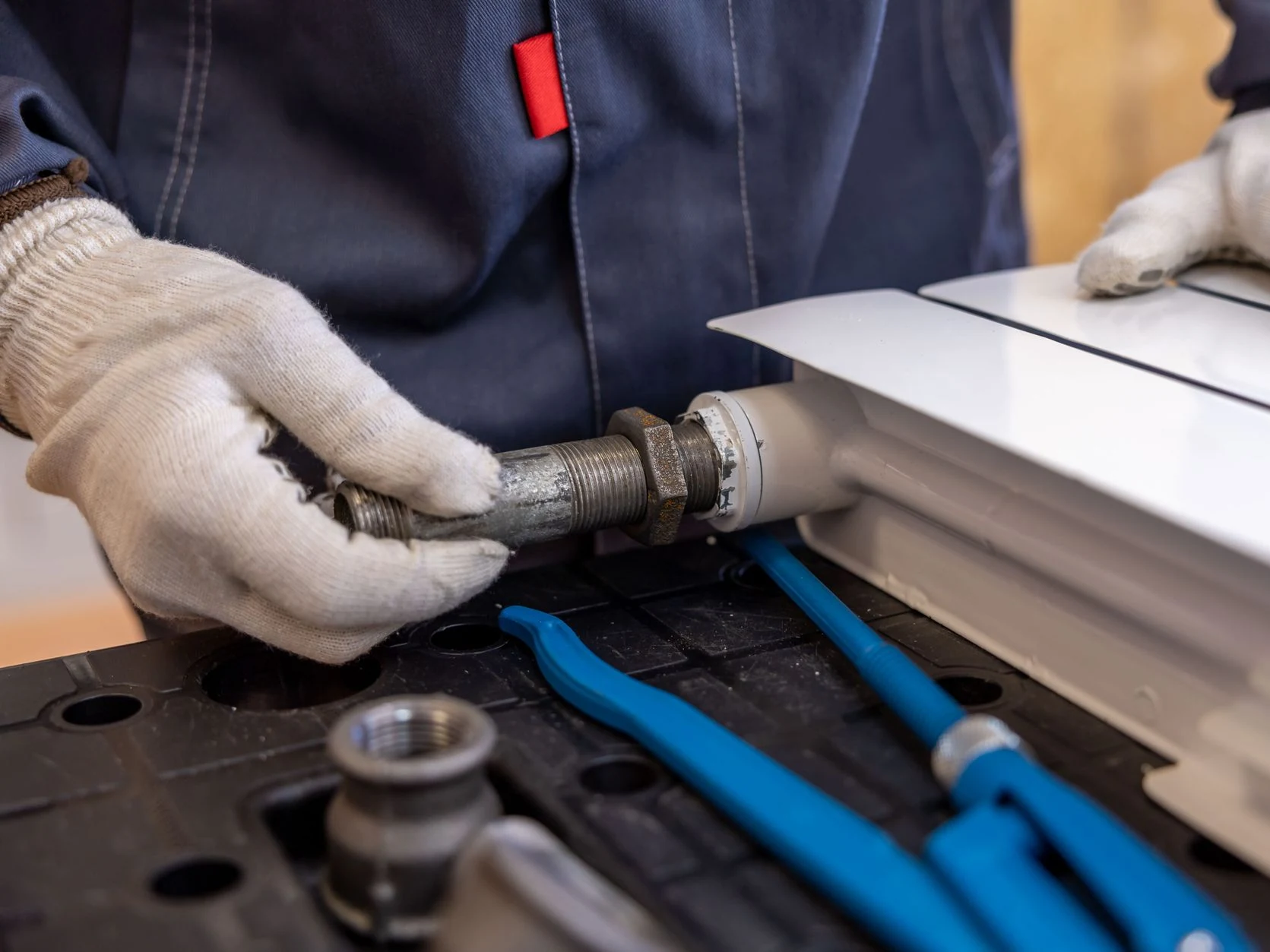 plumber working at Oakley Plumbing And Heating Solutions